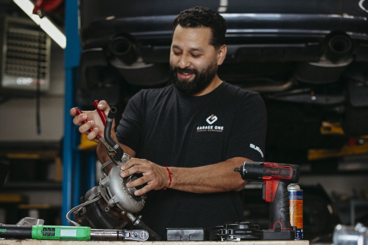Subaru technician performing certified repair for Hayward Subaru customer at Garage One Campbell